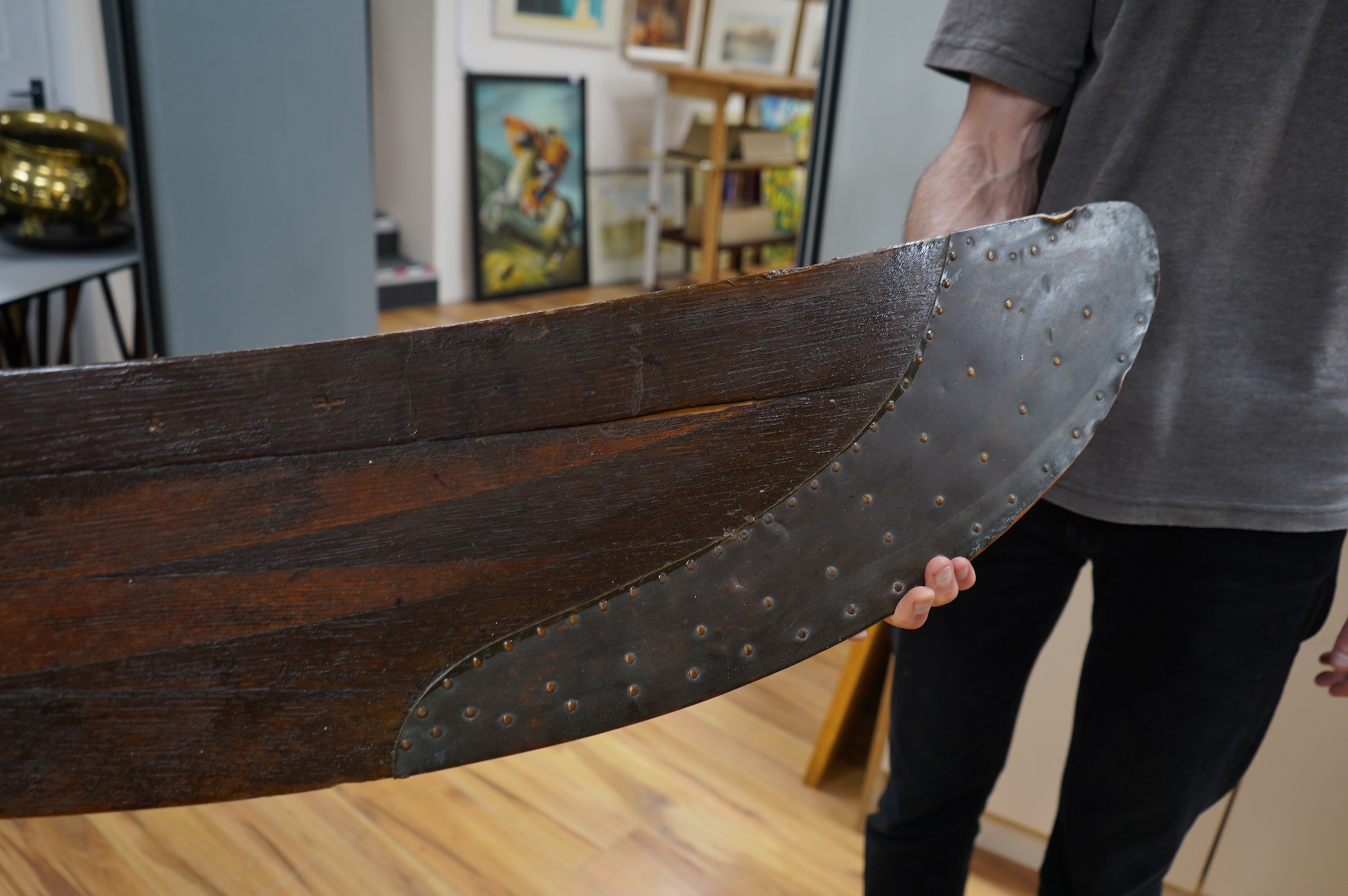 An early 20th century American laminated oak propeller with copper clad blade edges, Paragon stamp to the blade, 251cm wide. Condition - good